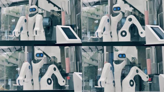 创新，现代技术理念。机器人在咖啡店里移动手臂