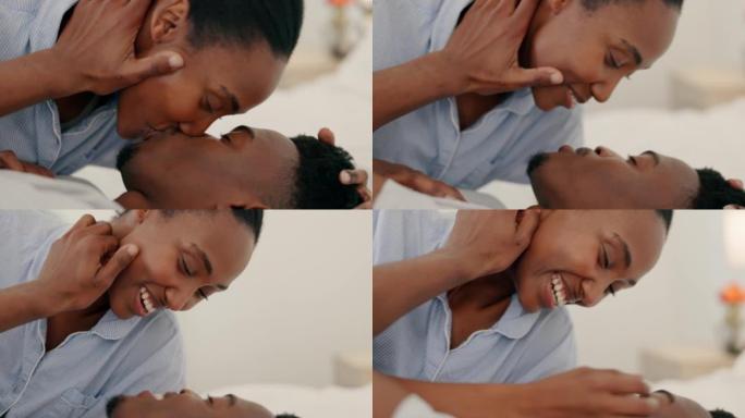 爱、亲吻和微笑卧室黑人夫妇在家在卧室里放松、浪漫和亲密。快乐，舒适和年轻的非洲人民在爱的关系，亲密和
