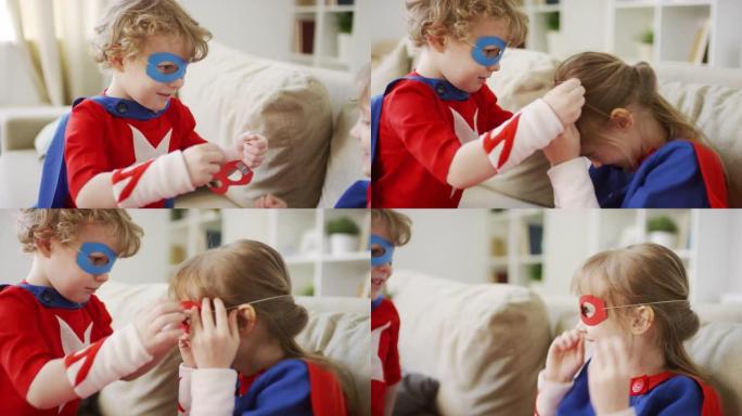男孩帮助姐姐戴上超级英雄面具
