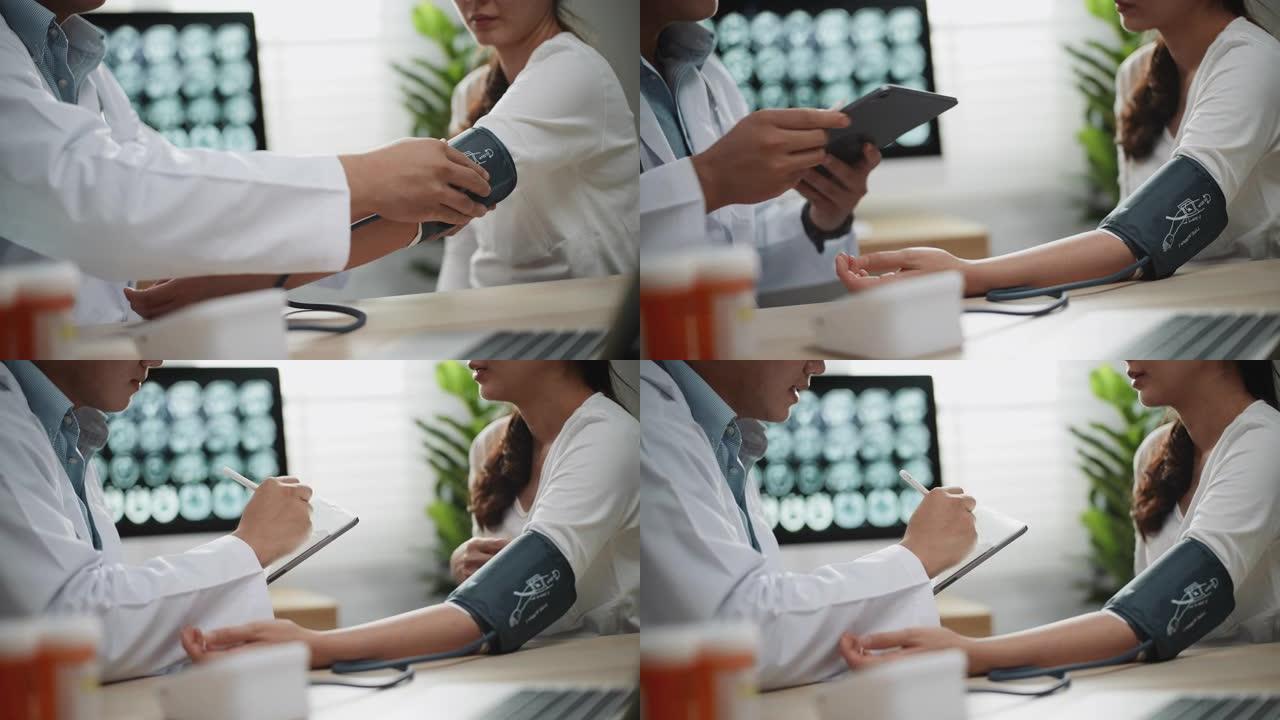 男性医生在办公室咨询女性患者时使用数字平板电脑