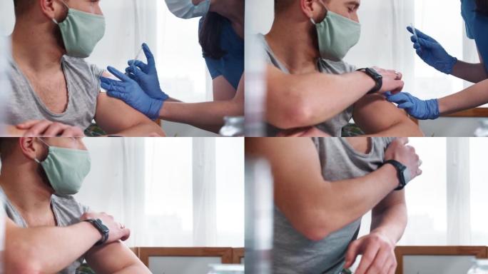 特写疫苗接种概念。穿着蓝色磨砂膏的护士用注射器给男性患者注射疫苗。