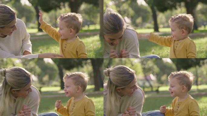 儿童，家庭和公园，母亲和儿子在花园里的草地上玩耍和坐在一起。自然，父母和乐趣与年轻女子和她的男孩结合