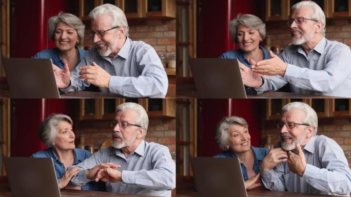 笑着真诚快乐的老年夫妇拿着视频通话对话。
