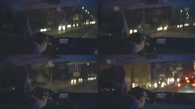男人晚上在城里开车。变形镜头拍摄