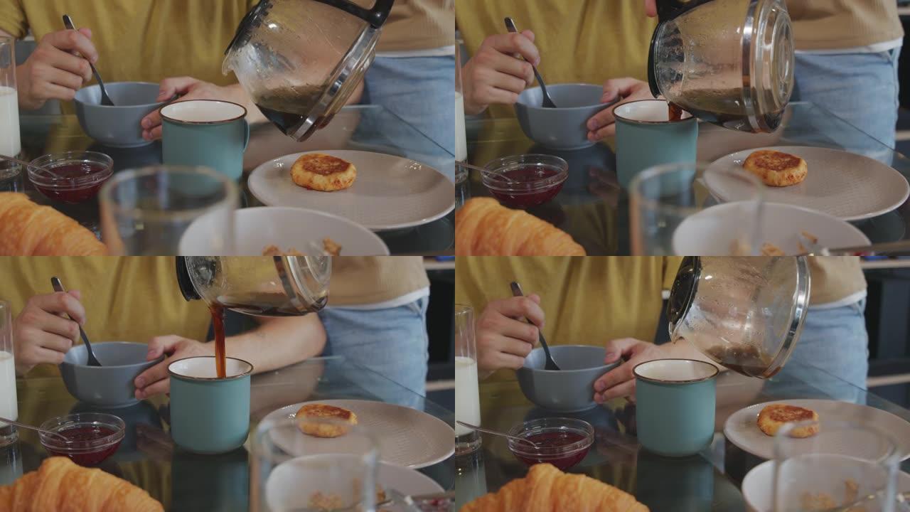 男人将咖啡倒入杯子的特写镜头