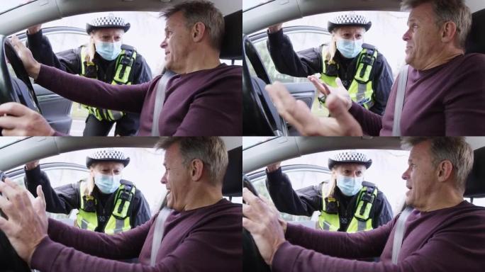 愤怒的男司机因驾驶违法行为被戴口罩的女交通警察拦下