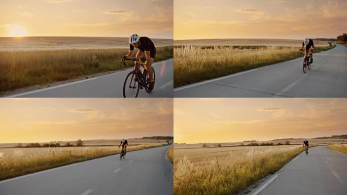 SLO MO成年自行车手在日落时快速驶过乡村