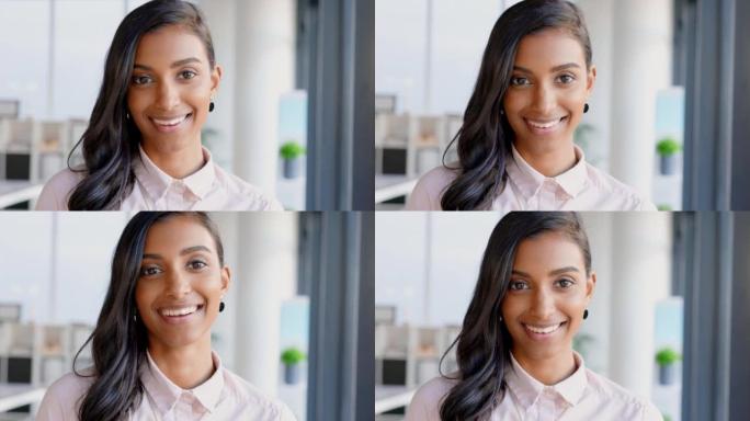 公司办公室里一个快乐的商界女性的脸。年轻自信的非洲企业家或时尚营销设计师站在室内明亮的现代房间里微笑