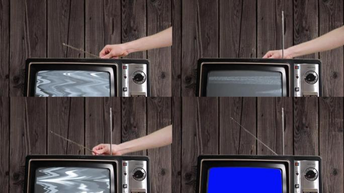 复古电视机对着木墙在房间里打开蓝屏。特写。