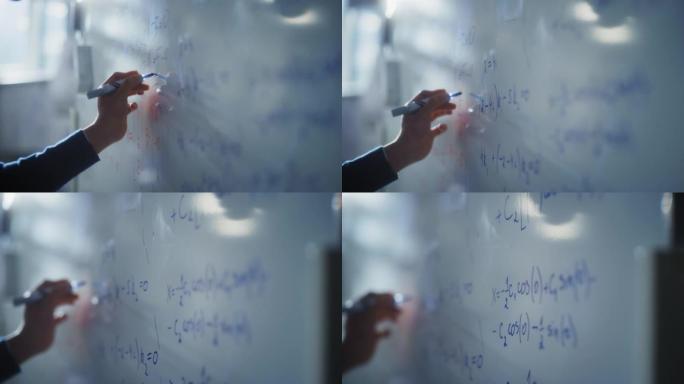 人类用蓝色记号笔在白板上绘制图表并写下数学公式。科教理念。宏跟随镜头
