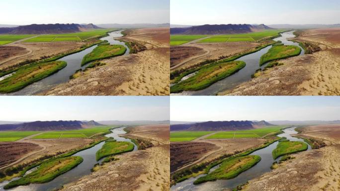 非洲纳米比亚阳光明媚的偏远沙漠中的WS河和郁郁葱葱的田野