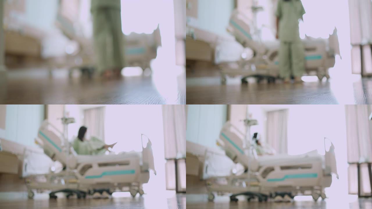女患者走到医院病床上的散焦镜头