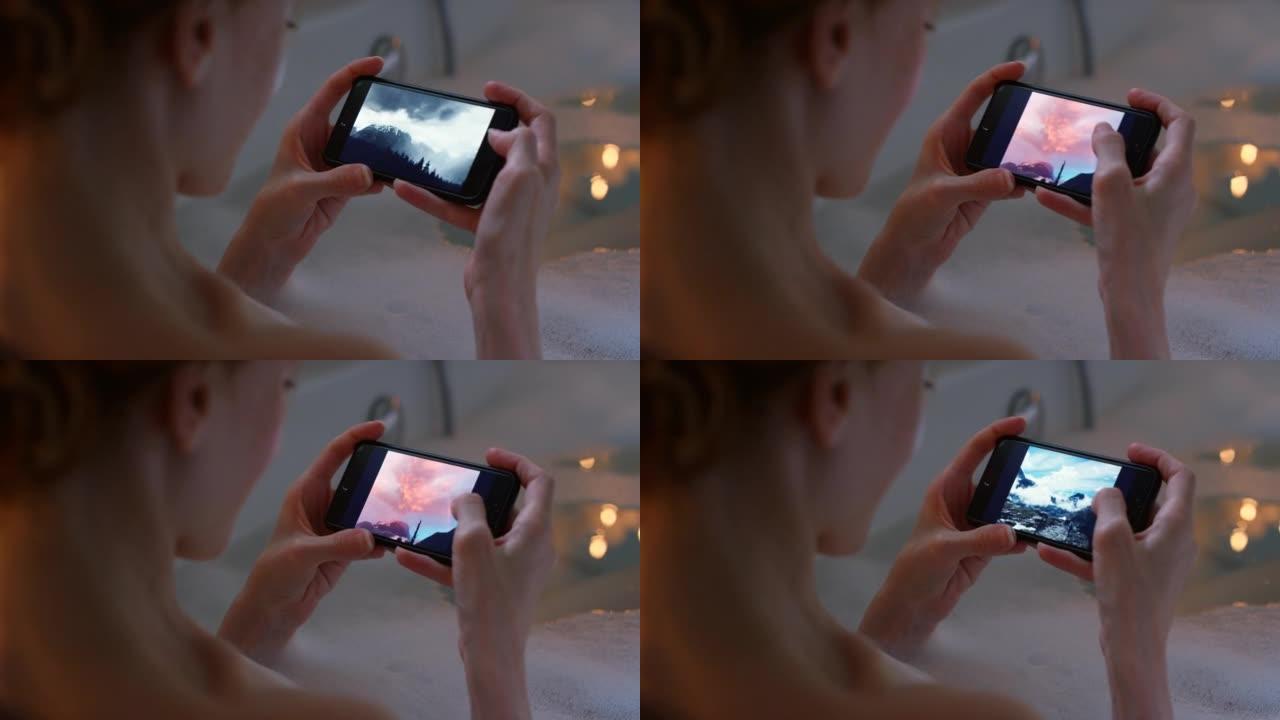 一名妇女在泡泡浴期间使用智能手机的4k视频片段