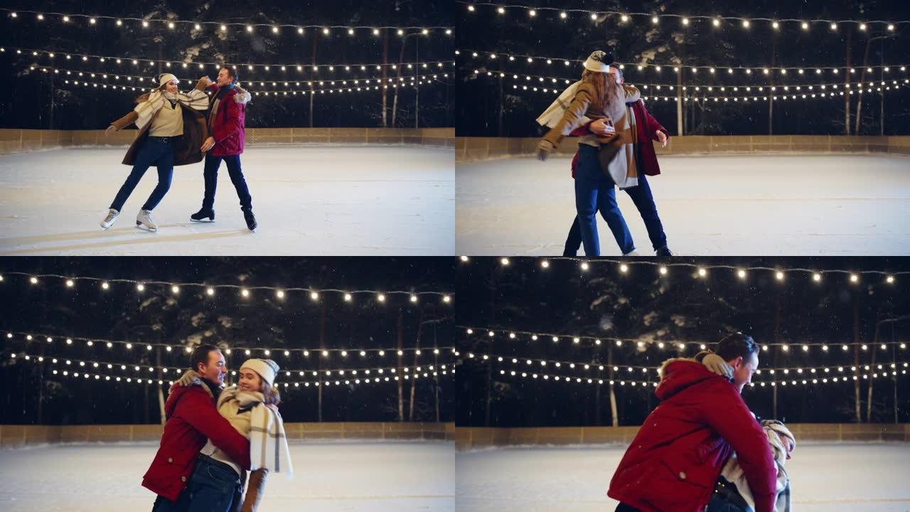 浪漫的冬天下雪的夜晚: 滑冰夫妇玩得开心，踏上溜冰场，开始跳舞，跳华尔兹。双人花样滑冰。温柔的年轻人