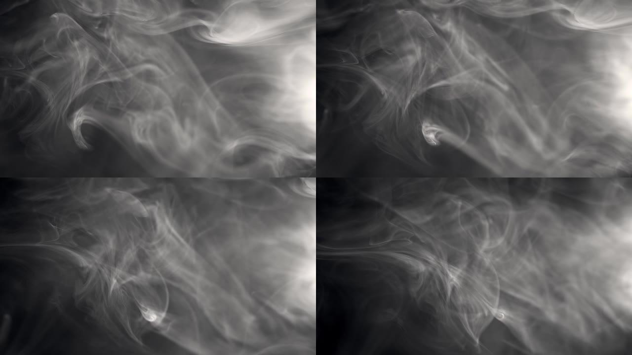 烟雾背景。白烟的慢动作镜头漂浮在黑色背景上的空中。雾，火烟，蒸气在黑暗中缓慢移动