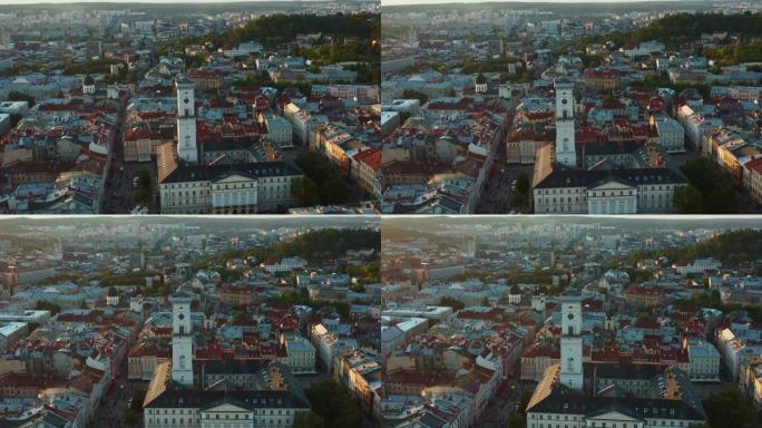 雄伟的空中风景，宁静的夏天日出，乌克兰利沃夫，美丽的旧市政厅塔楼和屋顶。