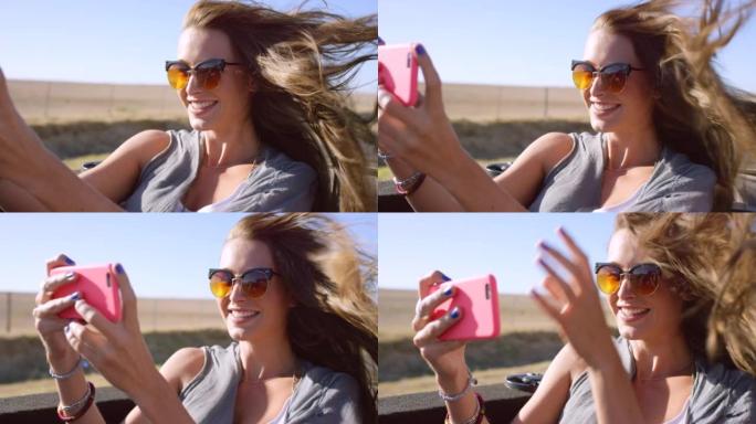 一名女性在公路旅行中在汽车上自拍的4k视频片段