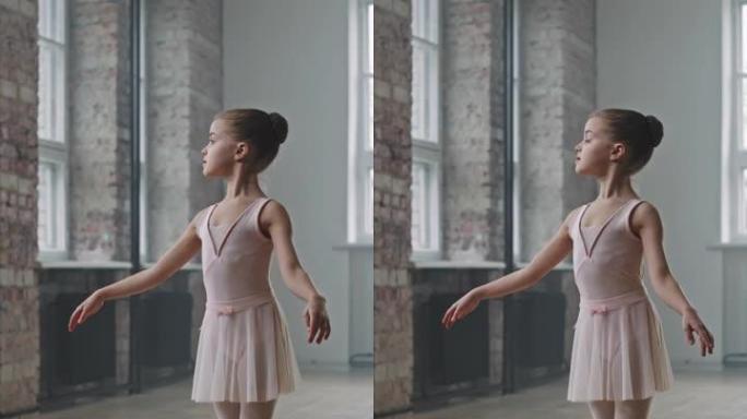 美丽的9岁芭蕾舞女演员站在她的脚趾上