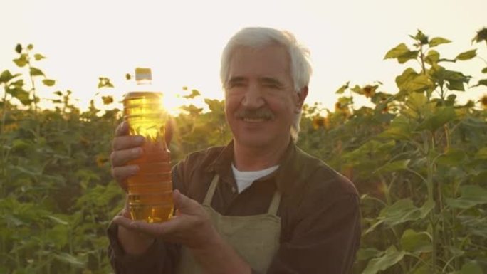 一瓶葵花籽油的农民肖像