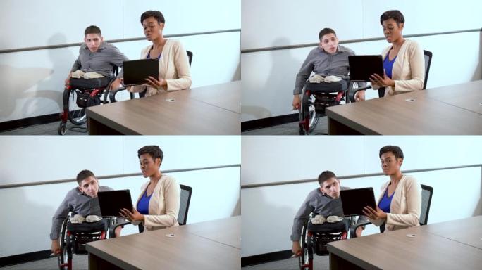坐轮椅的男人，商务会议的女人，笔记本电脑