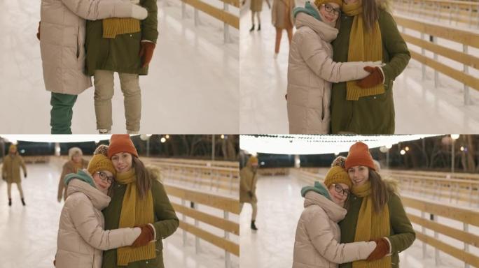 妈妈和女儿在溜冰场上拥抱