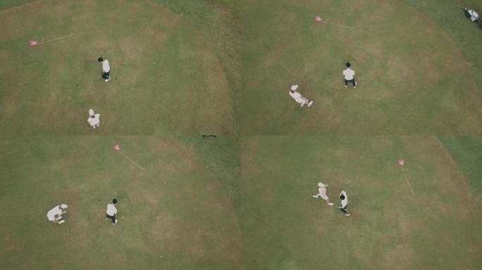 亚洲中国男高尔夫球手正上方的无人机视图与他的同伴在高尔夫球场上的高尔夫球洞附近排队