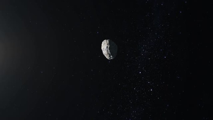 小行星在太空中飞行和旋转。小行星出现在屏幕上并迅速飞走。星空。4K.星星闪烁。3d渲染。
