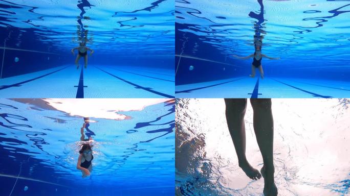 低角度视角亚洲中国女子游泳运动员游泳穿越游泳池