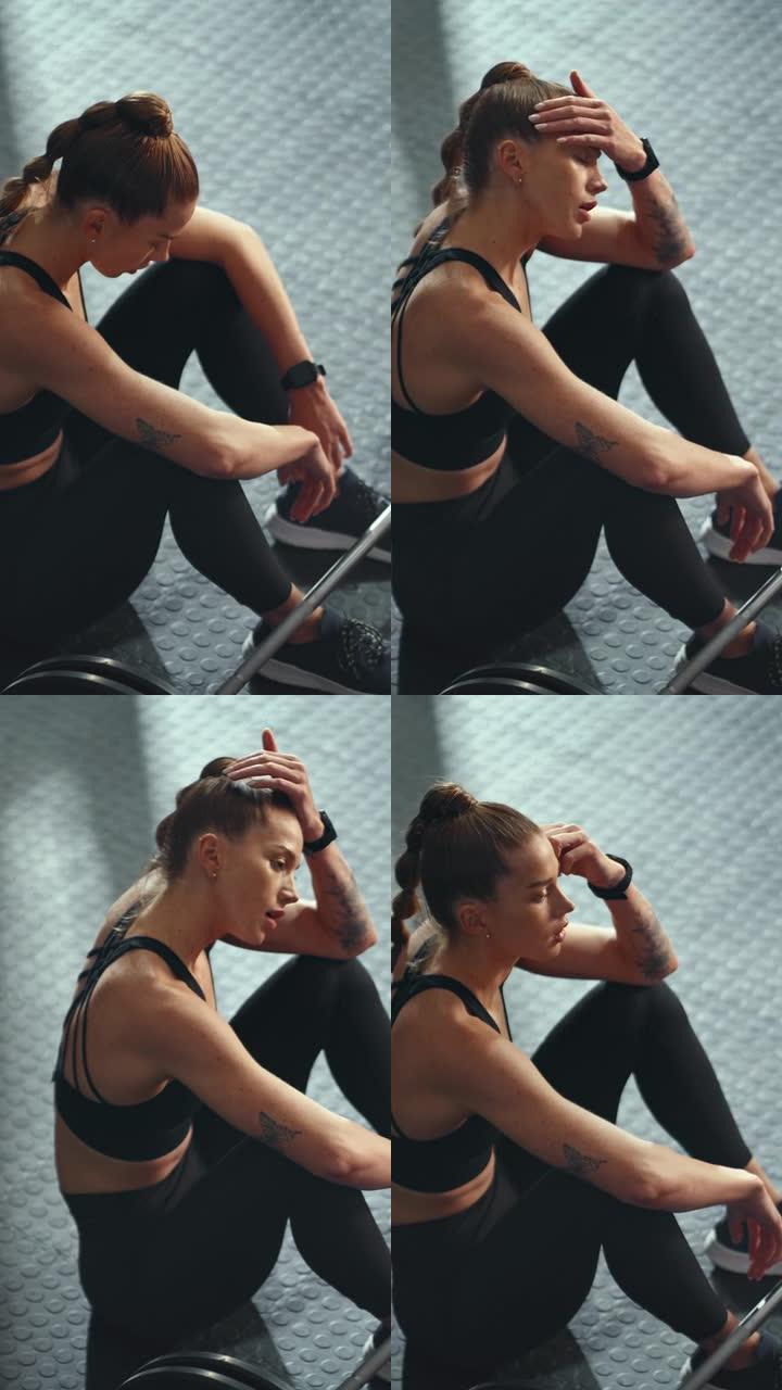 从杠铃运动，健身或举重运动中出汗的女人在健身房休息的俯视图。健美运动员挑战后疲劳的女运动员呼吸，训练