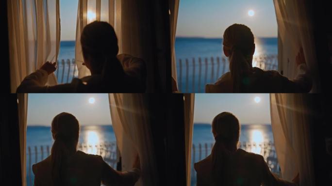 金发碧眼的女人早上打开酒店房间的透明窗帘，用太阳看着美丽的海景