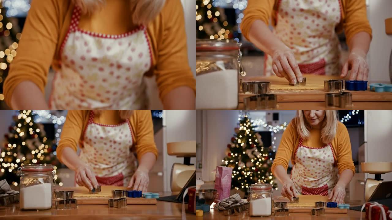 女人切成星形的圣诞饼干面团