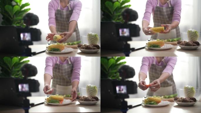 女人vlogger在数码相机上录制了准备烹饪的视频。