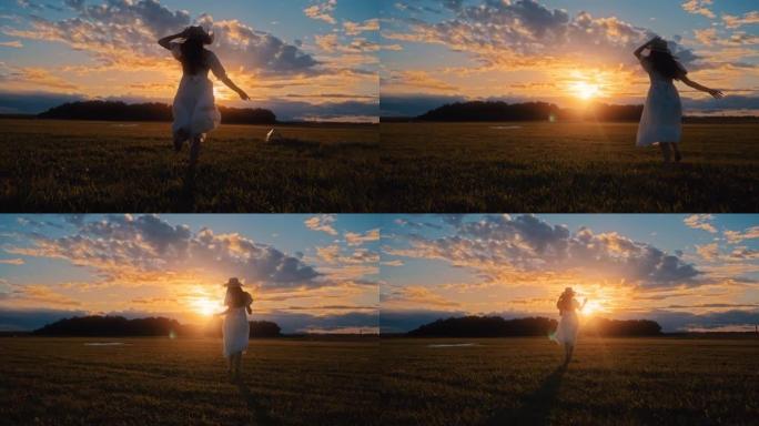 日落时，无忧无虑的年轻女子在田园诗般的乡村田野中奔跑