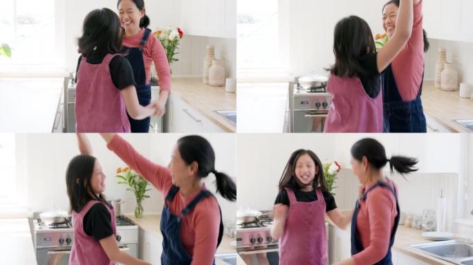 音乐，舞蹈和母亲与女孩在厨房里，快乐，跳舞，结合并在一起在家里玩得开心。家庭，广播和亚洲妈妈，女儿在