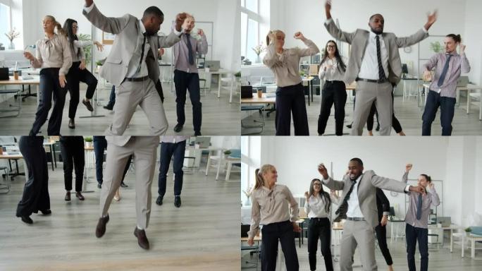 穿着正式服装的无忧无虑的男女在同事区的商务聚会上跳舞