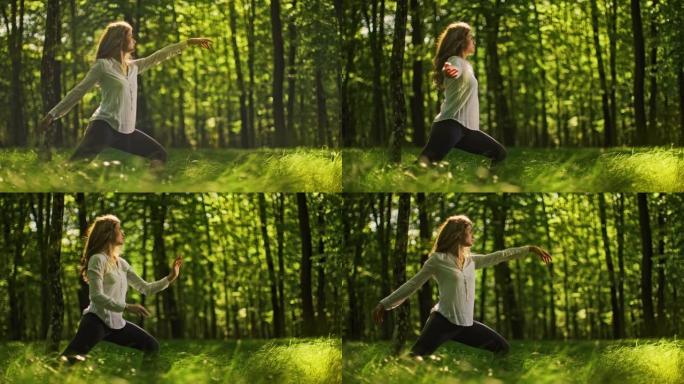 SLO MO年轻女子在阳光明媚的绿色森林中练习瑜伽
