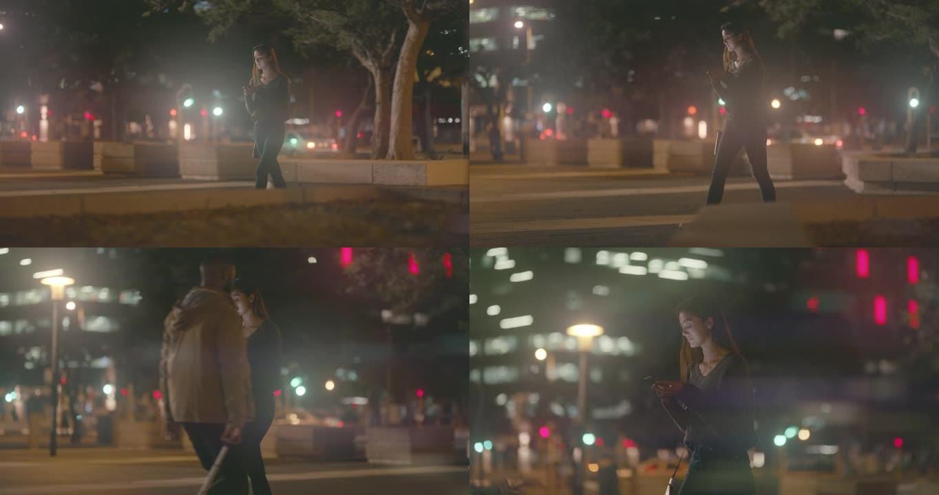4k视频片段，一名妇女晚上在外面散步时使用手机