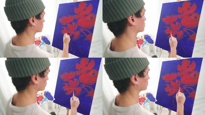 专注于他的新画的艺术家。
