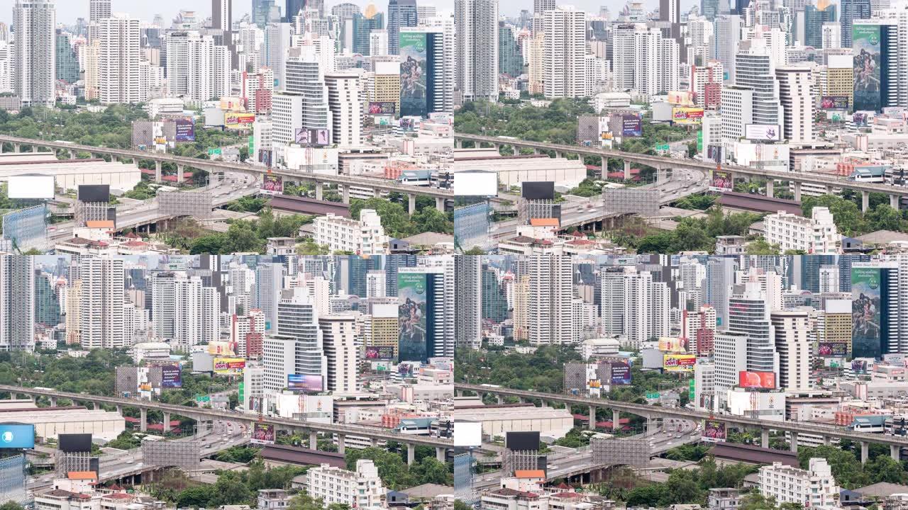 4K UHD放大延时: 曼谷市中心摩天大楼的天际线，高速公路上的汽车，泰国曼谷的天空列车。现代城市景