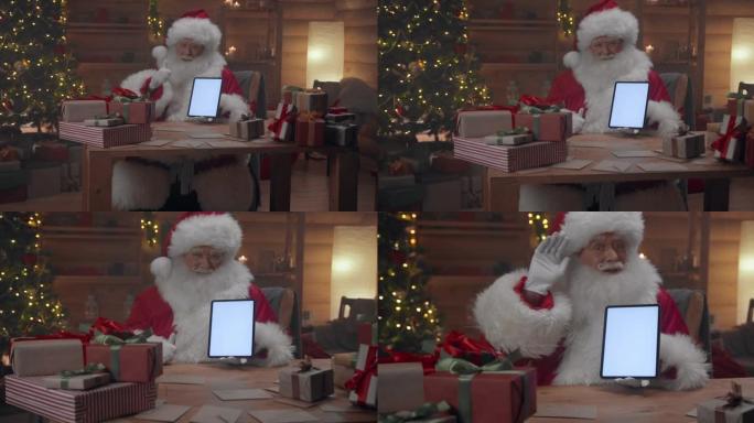 圣诞老人在相机中显示数字平板电脑的空屏幕，说再见