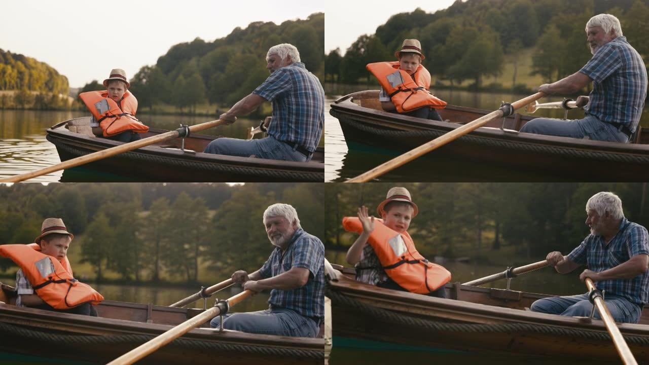 祖父带着孙子在湖上划船