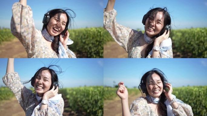 亚洲女性享受生活戴耳机听音乐开心快乐