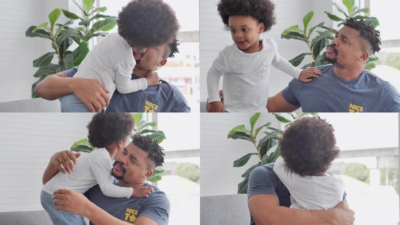 非洲父亲和小男孩的家庭一起度过时光，在家里亲吻温柔。爸爸和孩子温柔的时刻。父亲，父亲节，庆祝，团结，