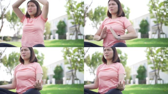 亚洲女性在公园瑜伽和锻炼