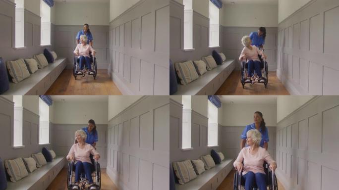 在家中的高级妇女被穿着制服的女护理人员推上轮椅