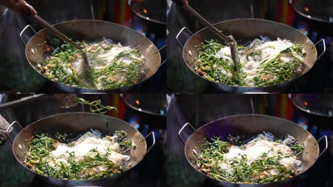 在炒锅中烹饪蔬菜炒菜特写视频素材