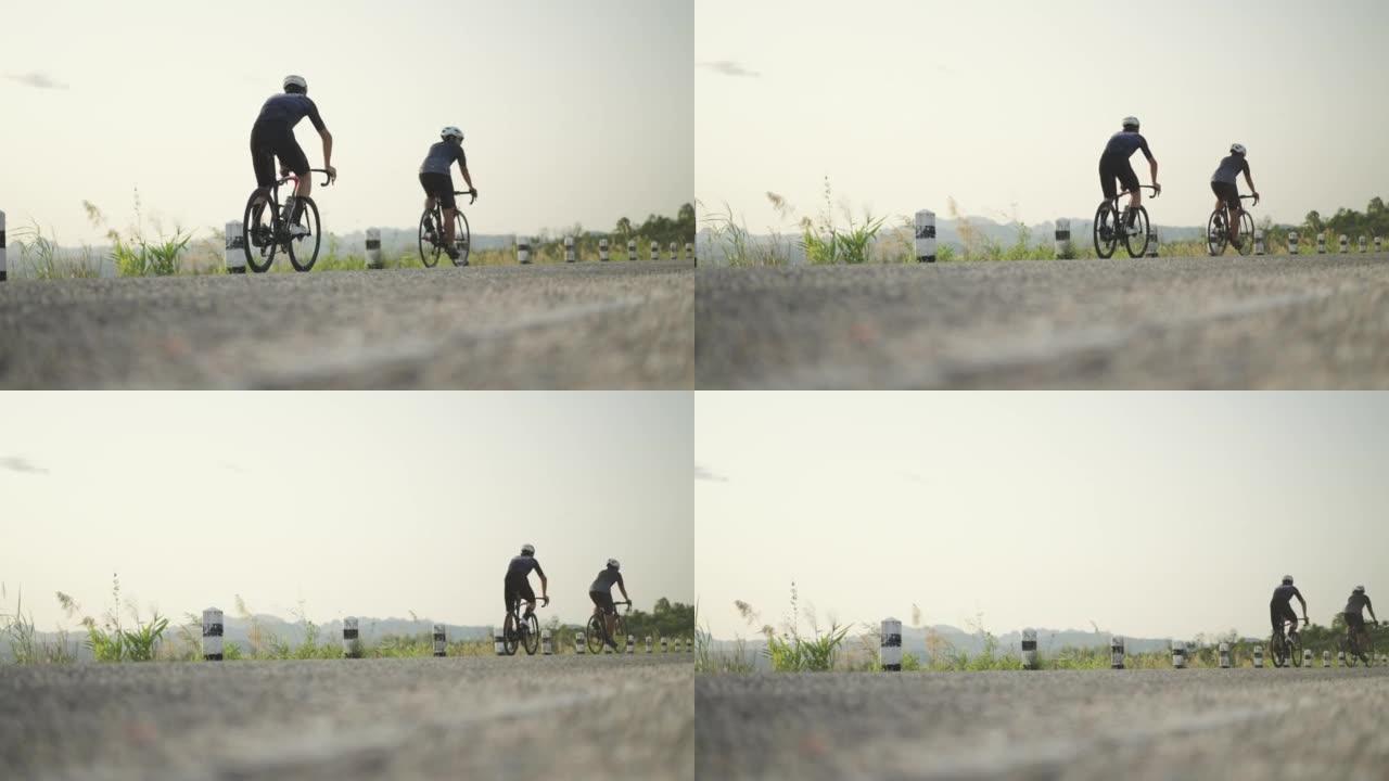 日落前中午通过骑自行车锻炼两名运动男子