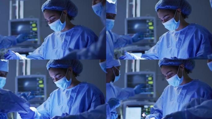 混血外科医生穿着防护服在手术室进行手术