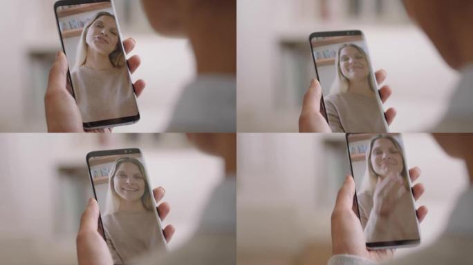 年轻女子在家中使用智能手机进行视频聊天，与朋友聊天，享受对话分享手机垂直方向的生活方式4k镜头