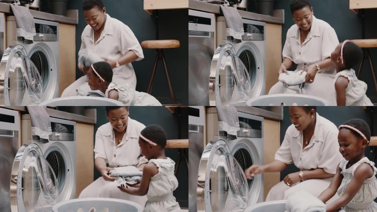 妈妈，孩子微笑和在洗衣机技术中一起教洗衣，以清洁，新鲜的衣服和快速的工作。快乐的黑人母亲，女孩学习家